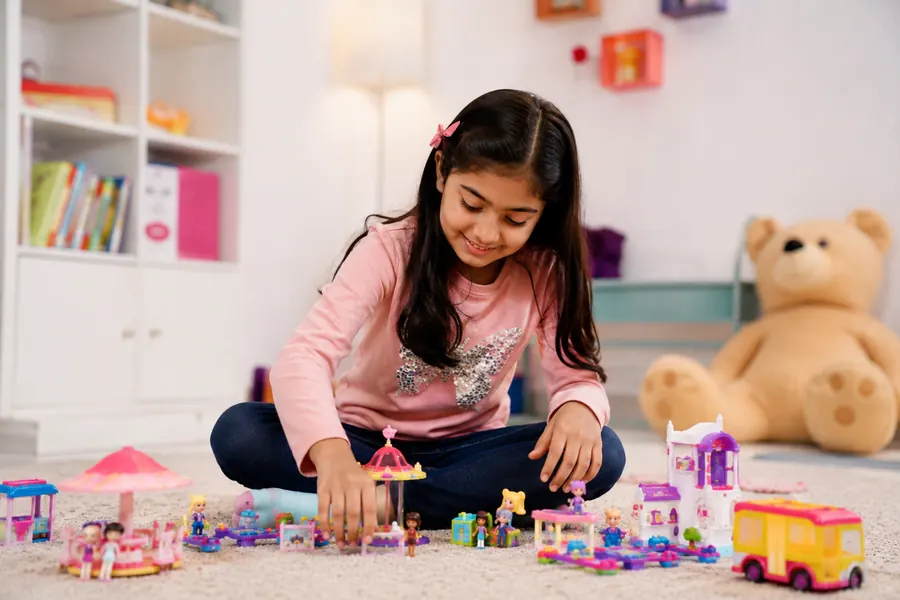 Older child with big kids toys